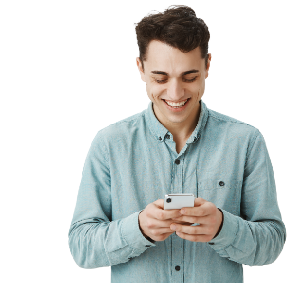 smiling man in front of his phone