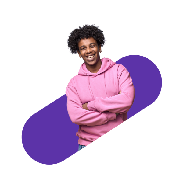 front-facing man smiling with crossed arms wearing a pink sweatshirt